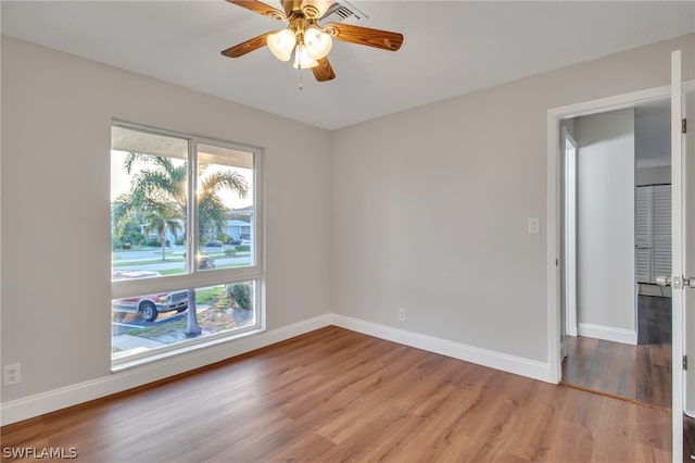 251 Palm Dr Unit 251-2, Naples, FL 34112 - empty room featuring light wood-type flooring, baseboards, and ceiling fan