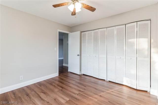 251 Palm Dr Unit 251-2, Naples, FL 34112 - unfurnished bedroom with baseboards, light wood-type flooring, a closet, and ceiling fan