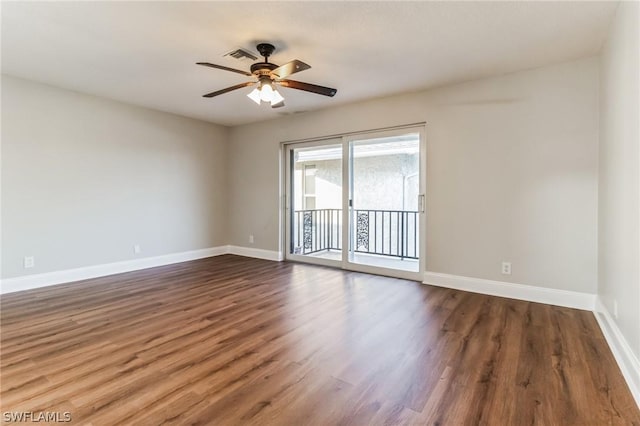 251 Palm Dr Unit 251-2, Naples, FL 34112 - spare room featuring dark wood-style floors, baseboards, and a ceiling fan