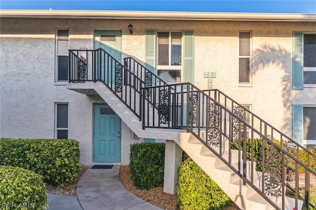 251 Palm Dr Unit 251-2, Naples, FL 34112 - view of building exterior featuring stairs