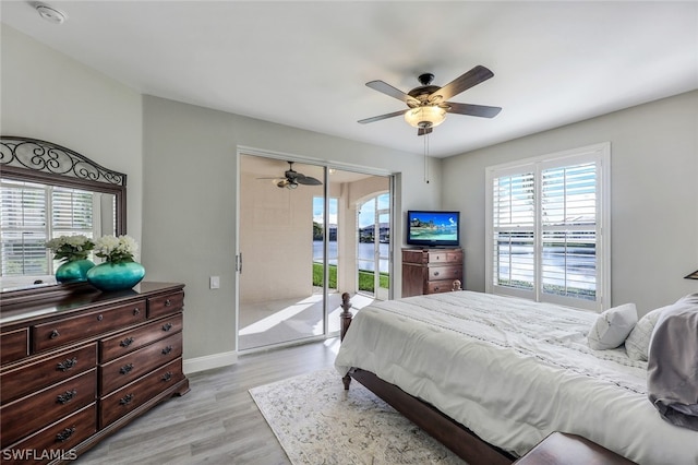 bedroom with ceiling fan, access to outside, and light hardwood / wood-style flooring