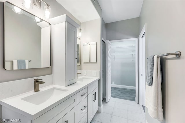 bathroom with tile patterned flooring and vanity