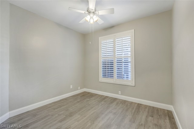 spare room with light hardwood / wood-style floors and ceiling fan