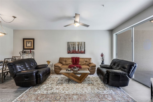 living room featuring hardwood / wood-style flooring and ceiling fan