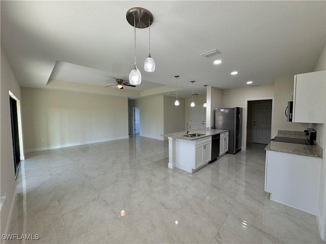 kitchen featuring sink, decorative light fixtures, white cabinets, a raised ceiling, and black appliances