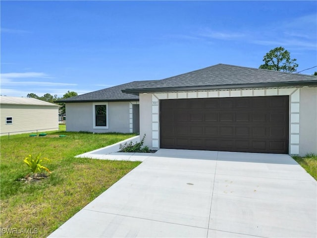 view of front facade with concrete driveway, stucco siding, a front lawn, a shingled roof, and a garage