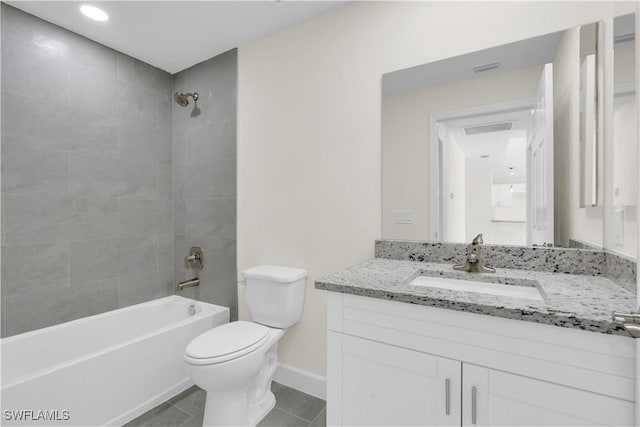 bathroom featuring toilet, shower / bathtub combination, tile patterned floors, baseboards, and vanity