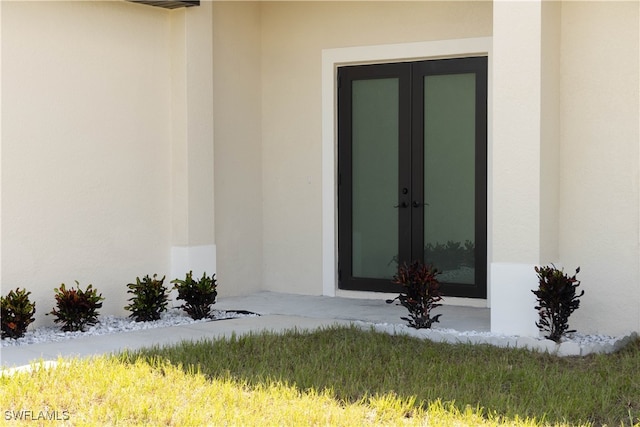 entrance to property featuring french doors