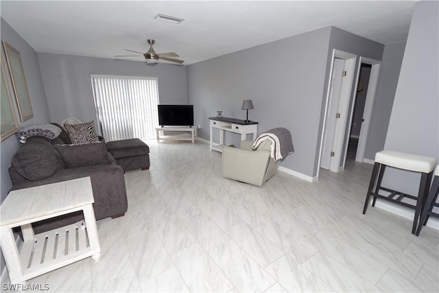 living room featuring ceiling fan