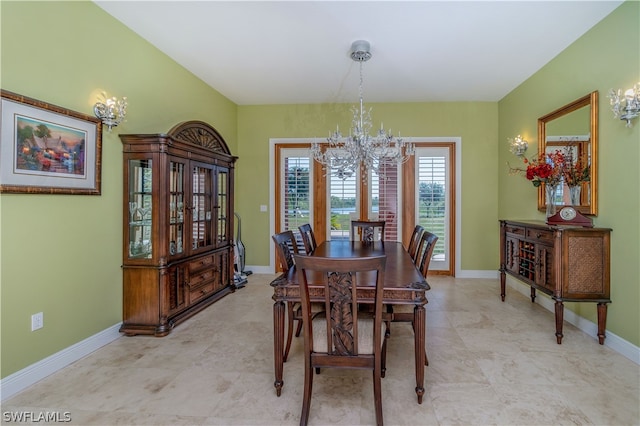 dining area with an inviting chandelier