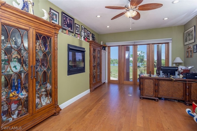 office space with french doors, light hardwood / wood-style flooring, and ceiling fan