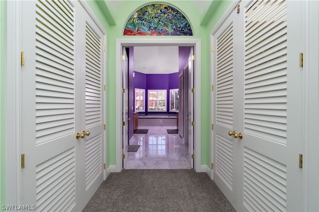 hallway featuring carpet flooring