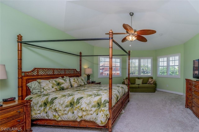 carpeted bedroom featuring ceiling fan and lofted ceiling