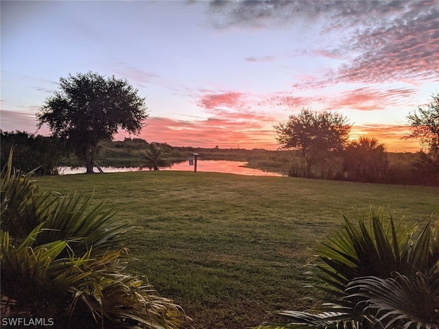 yard at dusk with a water view