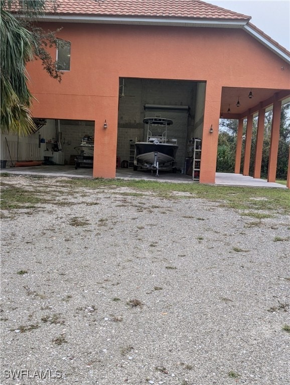 view of property exterior featuring a carport