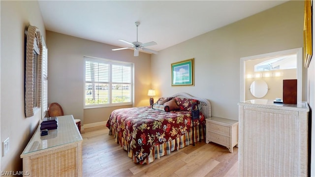 bedroom with light hardwood / wood-style floors and ceiling fan