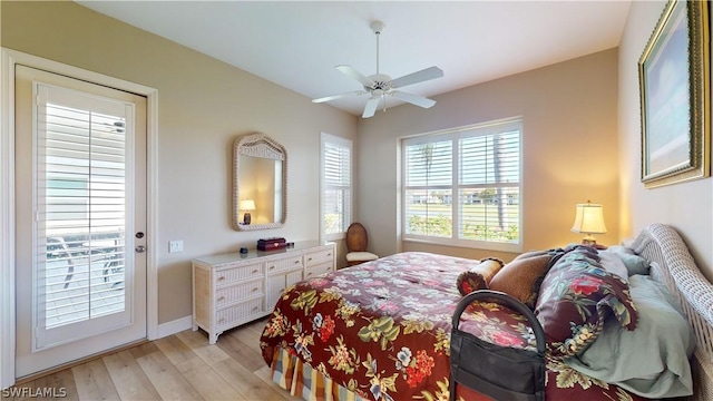 bedroom with access to exterior, ceiling fan, and light wood-type flooring