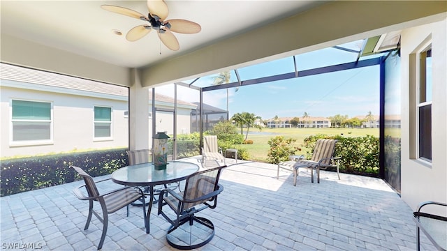 sunroom / solarium with ceiling fan