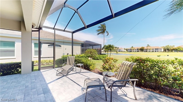 view of patio / terrace featuring glass enclosure