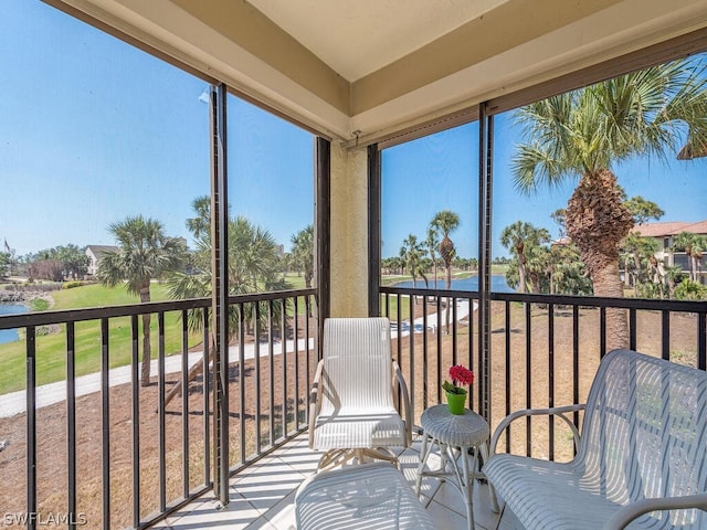 12621 Kelly Sands Way Unit 317, Fort Myers, FL 33908 - sunroom / solarium featuring a water view