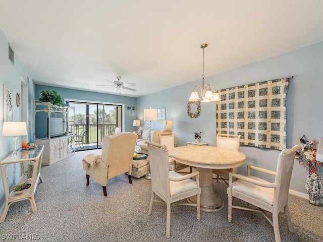 12621 Kelly Sands Way Unit 317, Fort Myers, FL 33908 - dining space featuring carpet, a ceiling fan, and a chandelier