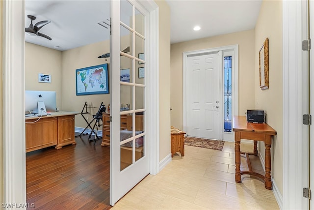 entryway with light wood-type flooring and ceiling fan