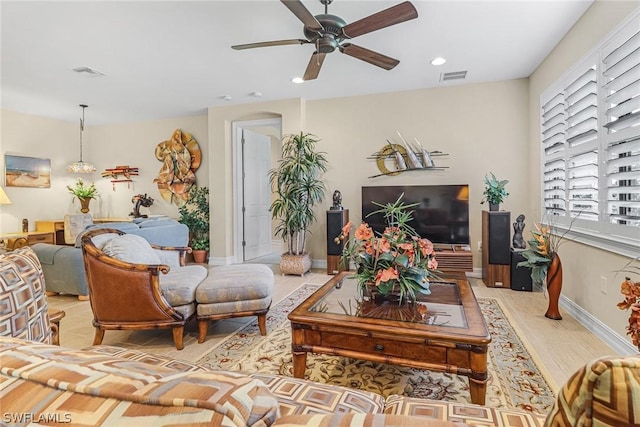 living room featuring ceiling fan