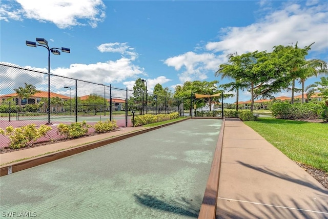 surrounding community with tennis court