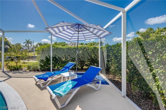 view of patio with a lanai