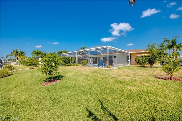 view of yard with glass enclosure