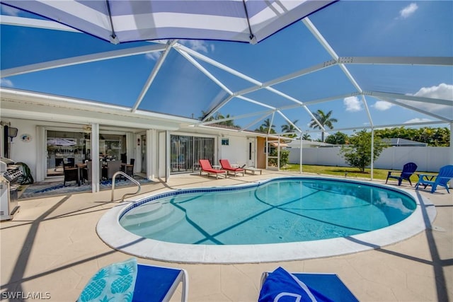 view of pool featuring a lanai and a patio area