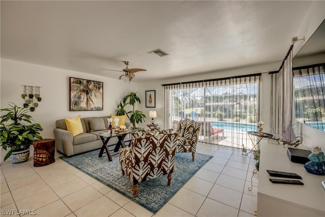 living room featuring ceiling fan and light tile patterned floors