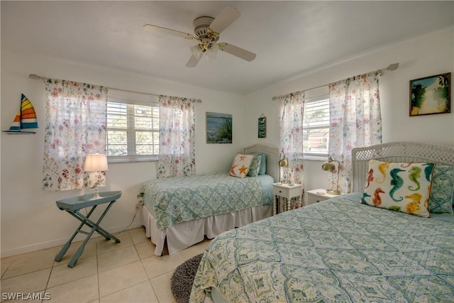 tiled bedroom with ceiling fan