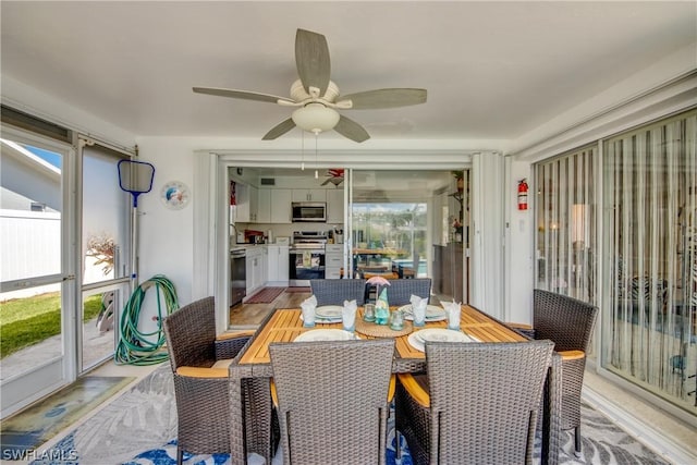 dining space with ceiling fan