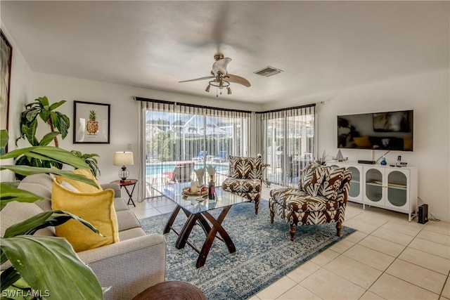 tiled living room featuring ceiling fan