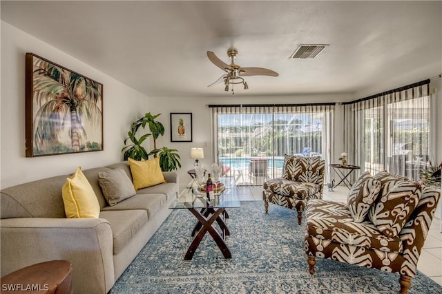 tiled living room featuring ceiling fan