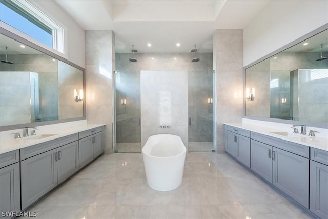 23517 Coconut Landing Dr, Estero, FL 34134 - full bath featuring two vanities, a sink, and a shower stall