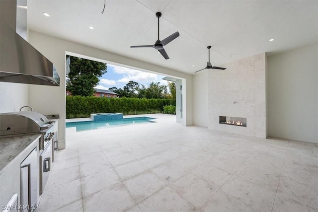 23517 Coconut Landing Dr, Estero, FL 34134 - exterior space with an outdoor kitchen, area for grilling, ceiling fan, a patio area, and a pool with connected hot tub