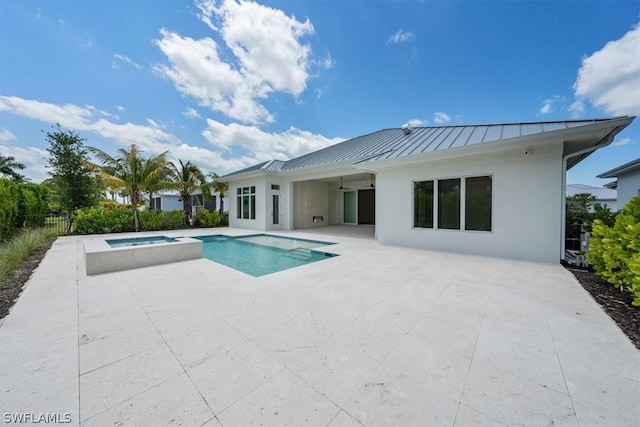 view of swimming pool featuring an in ground hot tub, a patio, and ceiling fan