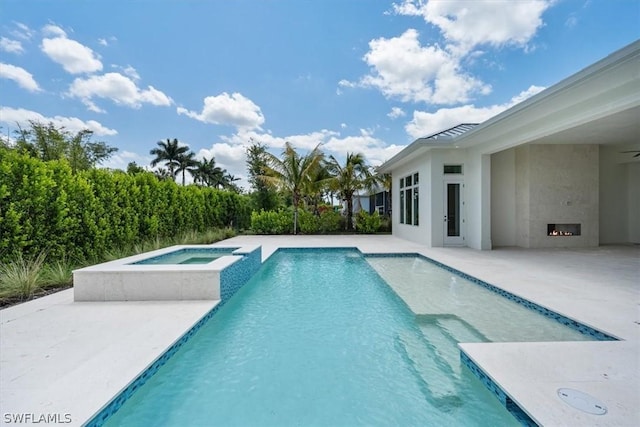 23517 Coconut Landing Dr, Estero, FL 34134 - view of swimming pool with a pool with connected hot tub and a patio area