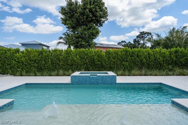 view of pool with an in ground hot tub