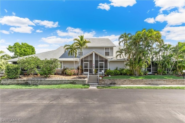 view of front of property with a sunroom