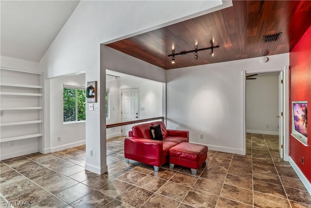 sitting room featuring track lighting, wooden ceiling, vaulted ceiling, and built in shelves