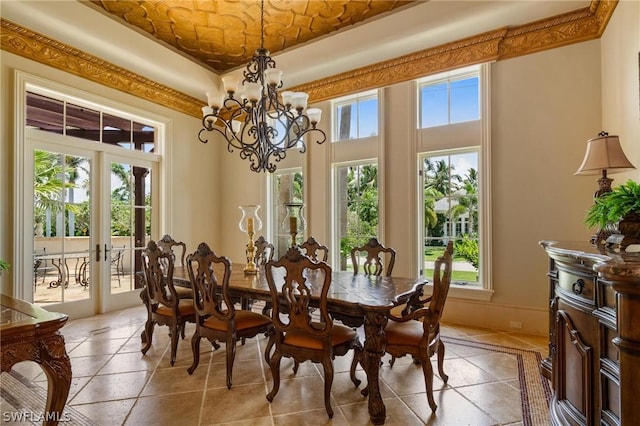 dining space with french doors and a notable chandelier