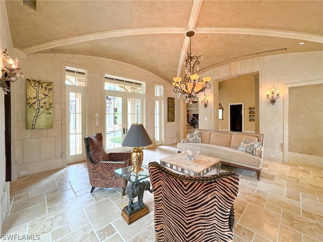 living room featuring a chandelier, french doors, and lofted ceiling with beams