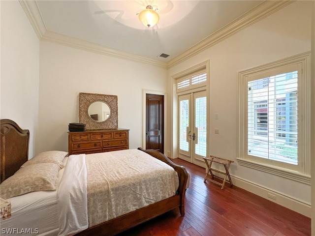 bedroom with french doors, access to outside, crown molding, and dark wood-type flooring