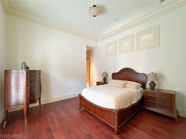 bedroom featuring crown molding and dark hardwood / wood-style floors