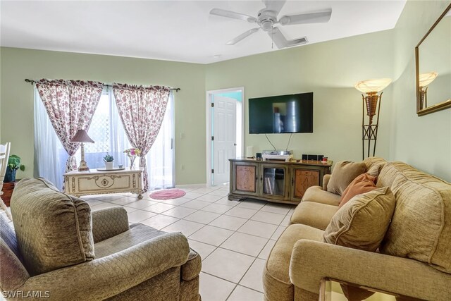 living room featuring ceiling fan and light tile patterned flooring