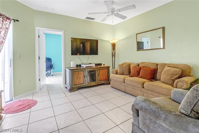 living room with light tile patterned floors and ceiling fan