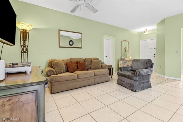 tiled living room with ceiling fan